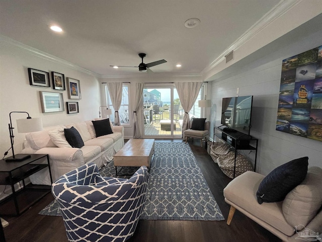 living room featuring dark wood finished floors and ornamental molding