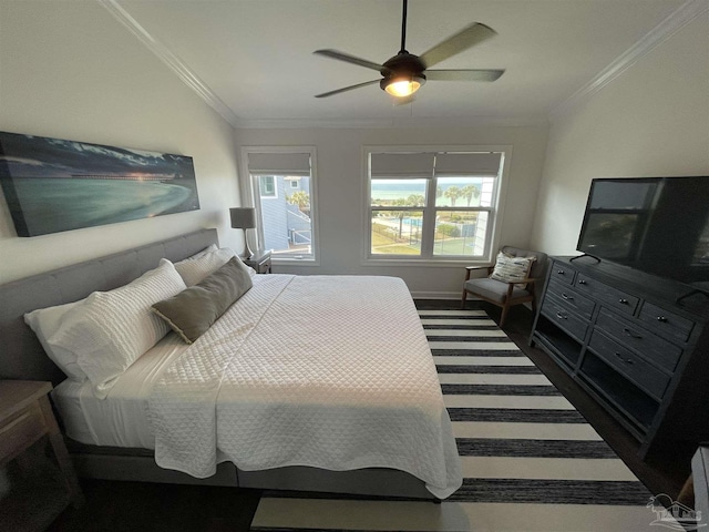 bedroom with multiple windows, ceiling fan, and ornamental molding