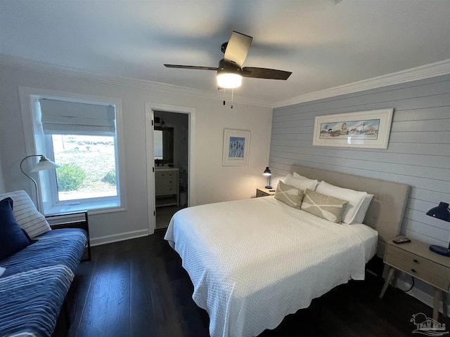 bedroom featuring crown molding, connected bathroom, dark wood-style floors, and ceiling fan