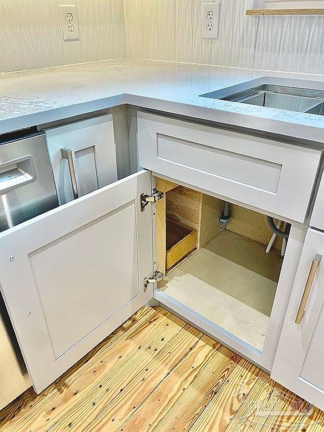 details featuring white cabinetry and light hardwood / wood-style flooring