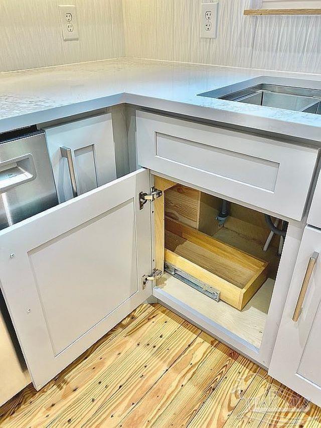 room details featuring light hardwood / wood-style floors and white cabinetry