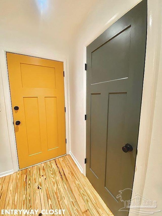 entryway with hardwood / wood-style flooring