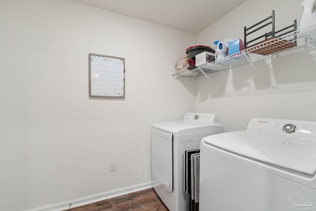 clothes washing area with laundry area, baseboards, dark wood-style flooring, and independent washer and dryer