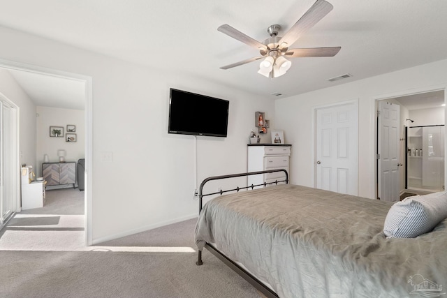 bedroom featuring baseboards, visible vents, a ceiling fan, and light colored carpet