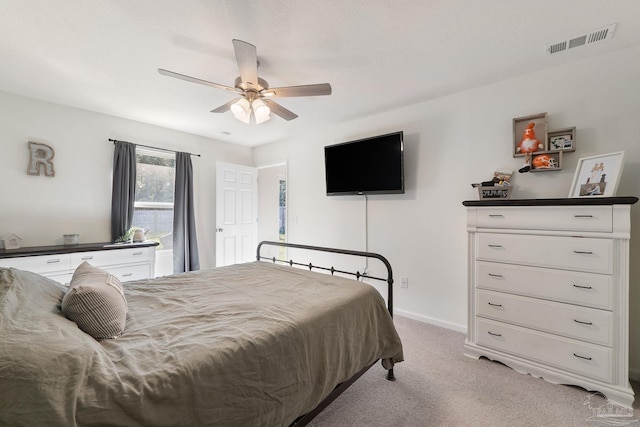 bedroom with visible vents, ceiling fan, light carpet, and baseboards