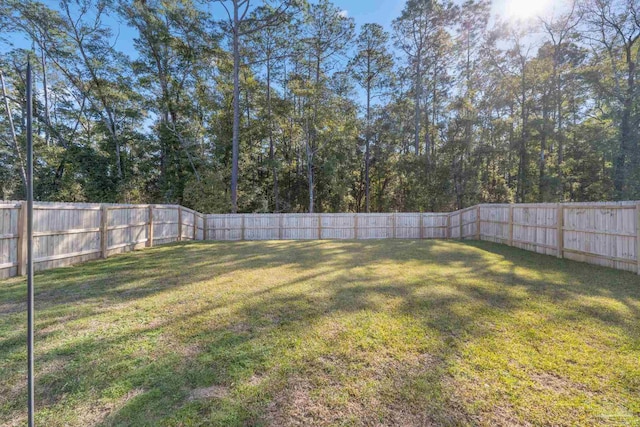 view of yard featuring a fenced backyard