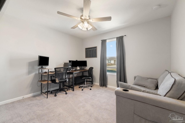 office area featuring light colored carpet, ceiling fan, and baseboards