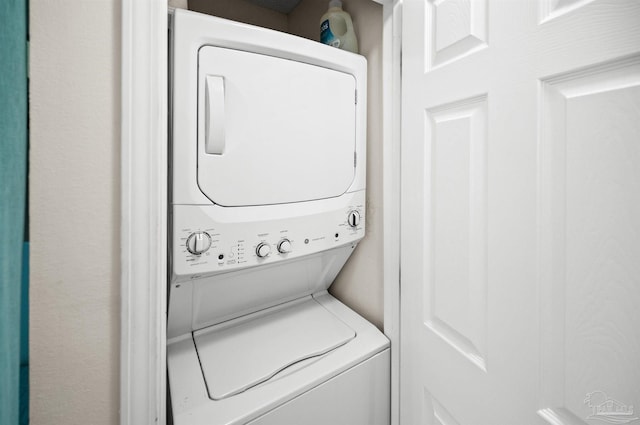 laundry room featuring stacked washer / dryer