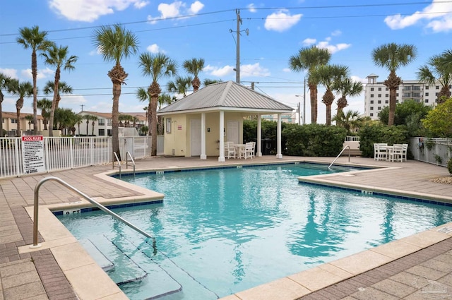 view of swimming pool featuring a patio area