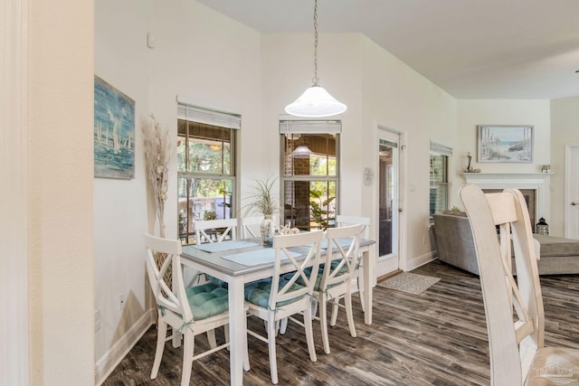 dining area with dark wood-type flooring