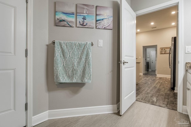 bathroom featuring wood-type flooring