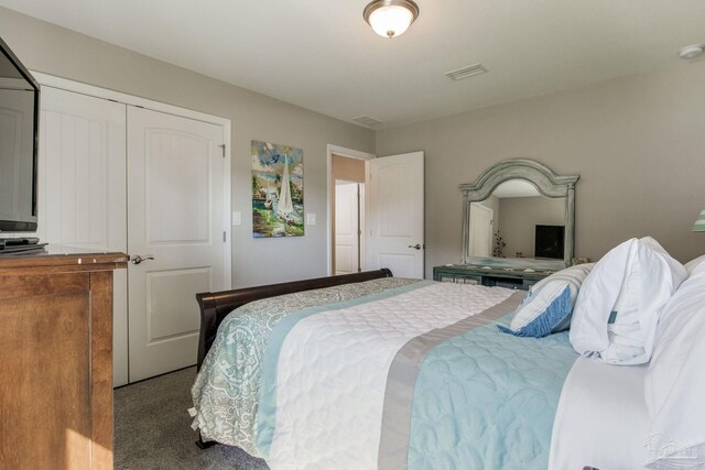 carpeted bedroom with a closet