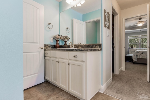 bathroom featuring tile patterned flooring, vanity, and ceiling fan