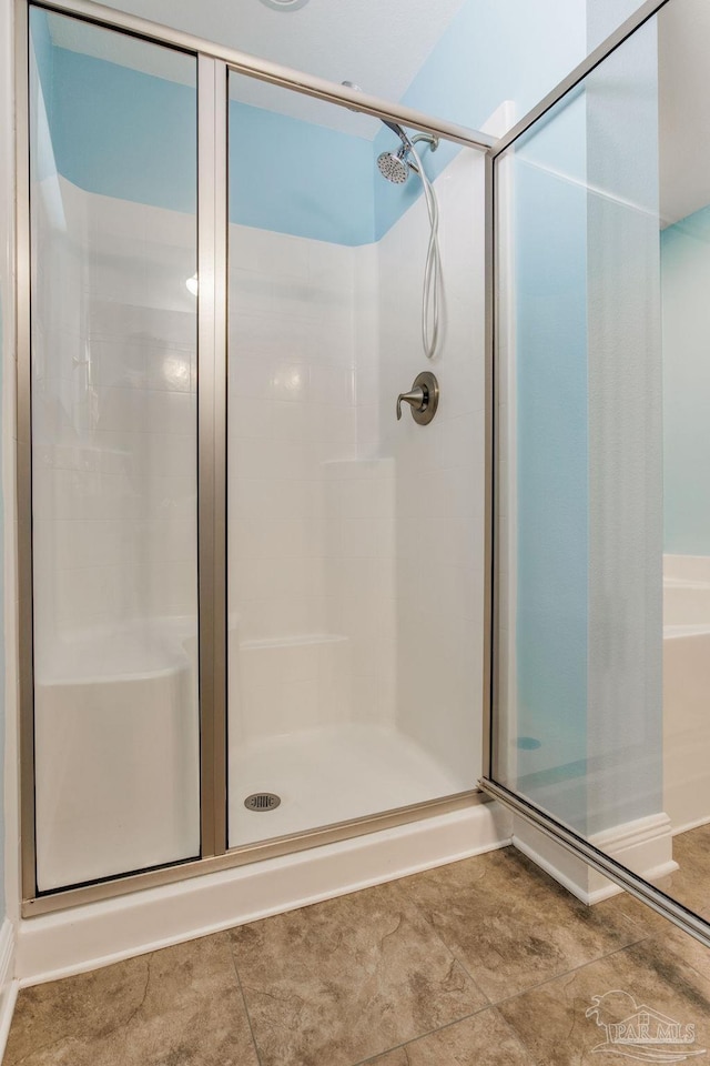 bathroom featuring tile patterned flooring and walk in shower