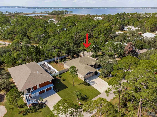 birds eye view of property with a water view