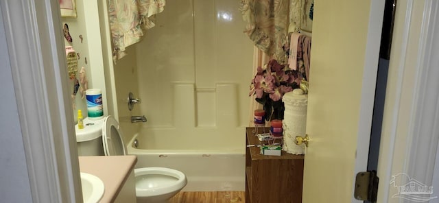 full bathroom featuring vanity,  shower combination, toilet, and wood-type flooring