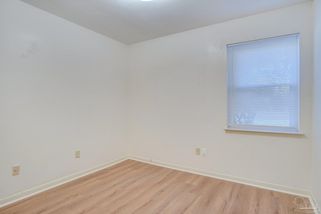 unfurnished room with light hardwood / wood-style floors