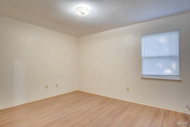 unfurnished room with light wood-type flooring