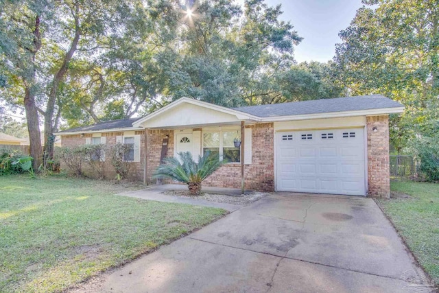 ranch-style home featuring a garage and a front lawn