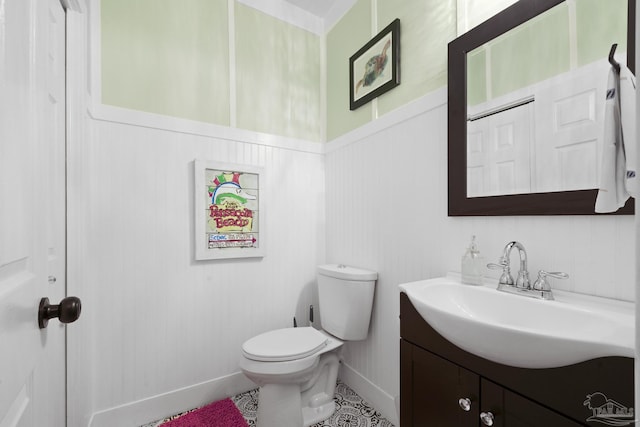 bathroom featuring toilet and vanity