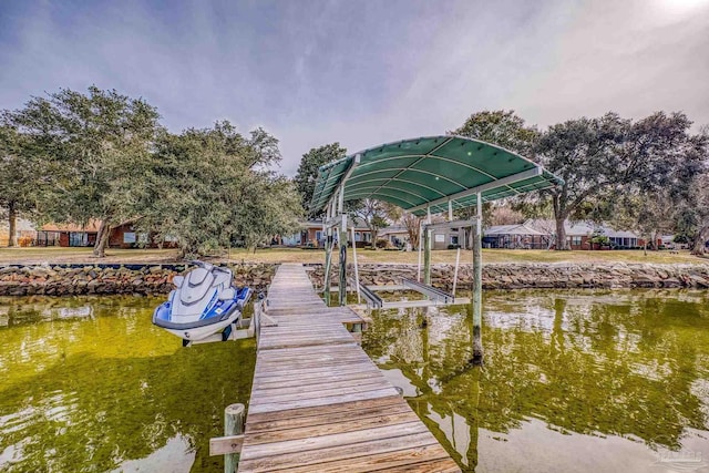 view of dock with a water view and boat lift