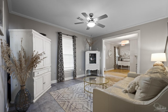 living area featuring baseboards, visible vents, ceiling fan, and crown molding