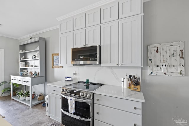 kitchen with decorative backsplash, appliances with stainless steel finishes, ornamental molding, light countertops, and open shelves