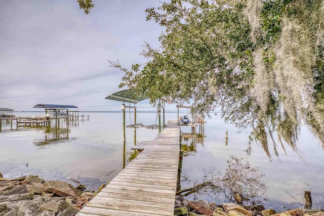 view of dock with a water view and boat lift