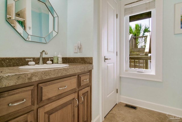 2961 Bay St, Gulf Breeze, FL 32563 - bathroom featuring vanity, tile patterned flooring, and baseboards