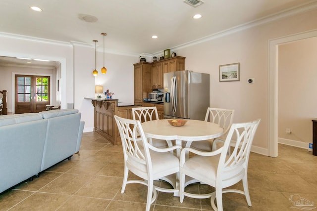 2961 Bay St, Gulf Breeze, FL 32563 - dining space with ornamental molding, recessed lighting, light tile patterned floors, and baseboards