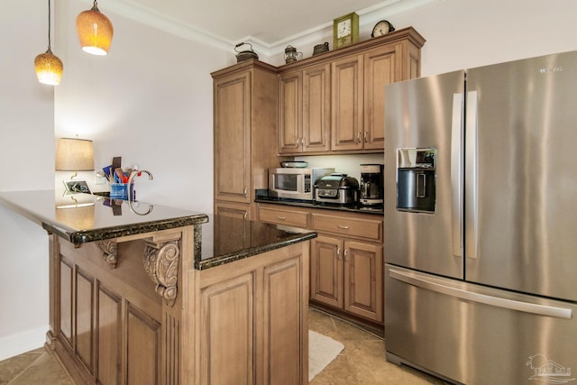 2961 Bay St, Gulf Breeze, FL 32563 - kitchen featuring appliances with stainless steel finishes, crown molding, brown cabinets, dark stone countertops, and light tile patterned floors