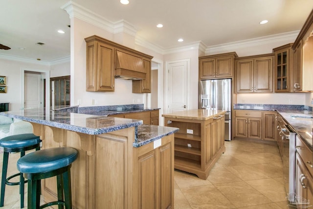2961 Bay St, Gulf Breeze, FL 32563 - kitchen with appliances with stainless steel finishes, open shelves, custom exhaust hood, a peninsula, and dark stone counters