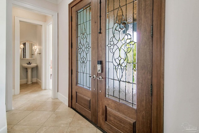 2961 Bay St, Gulf Breeze, FL 32563 - foyer entrance featuring french doors, baseboards, plenty of natural light, and light tile patterned floors