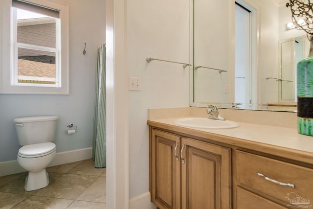 2961 Bay St, Gulf Breeze, FL 32563 - full bath with vanity, toilet, baseboards, and tile patterned flooring