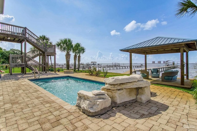 2961 Bay St, Gulf Breeze, FL 32563 - view of swimming pool featuring stairs, a water view, and a patio area