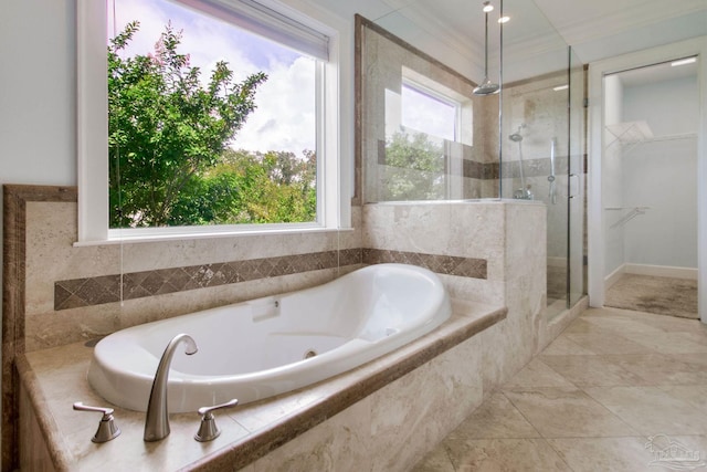 2961 Bay St, Gulf Breeze, FL 32563 - full bath featuring a stall shower, a whirlpool tub, tile patterned floors, ornamental molding, and a walk in closet