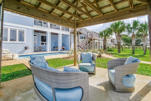 2961 Bay St, Gulf Breeze, FL 32563 - view of patio / terrace with stairs, a balcony, and an outdoor pool