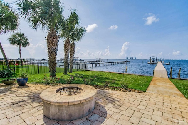2961 Bay St, Gulf Breeze, FL 32563 - view of patio / terrace with a dock, a water view, and a fire pit