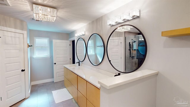 full bathroom with baseboards and double vanity