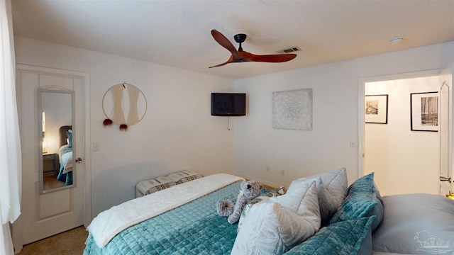 bedroom featuring ceiling fan, carpet flooring, and visible vents