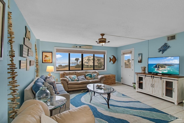 living room with a textured ceiling