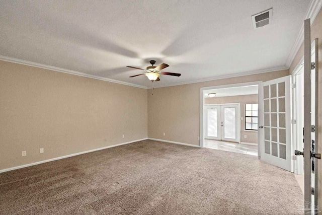 carpeted empty room with french doors, crown molding, a textured ceiling, and ceiling fan