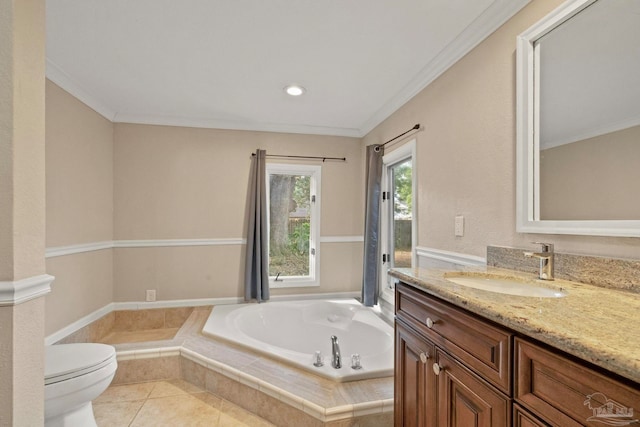 bathroom with tiled bath, toilet, tile patterned floors, vanity, and ornamental molding