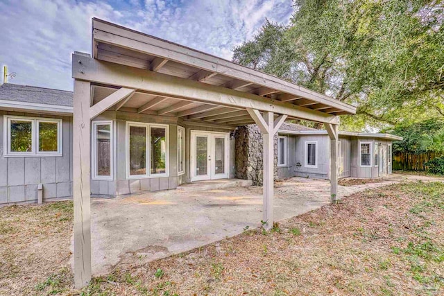 back of property featuring a patio and french doors