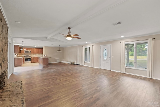 unfurnished living room featuring crown molding, lofted ceiling with beams, ceiling fan, and dark hardwood / wood-style flooring