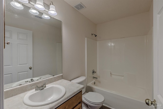 full bathroom featuring visible vents, toilet, shower / tub combination, a textured ceiling, and vanity