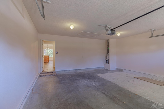 garage featuring baseboards and a garage door opener