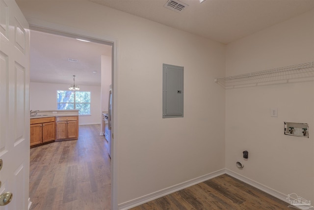 laundry area featuring washer hookup, visible vents, wood finished floors, laundry area, and electric panel