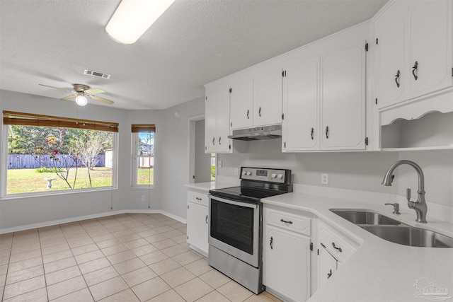 kitchen with ceiling fan, white cabinetry, electric stove, and sink