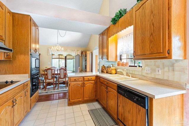 kitchen with black appliances, kitchen peninsula, sink, hanging light fixtures, and a chandelier